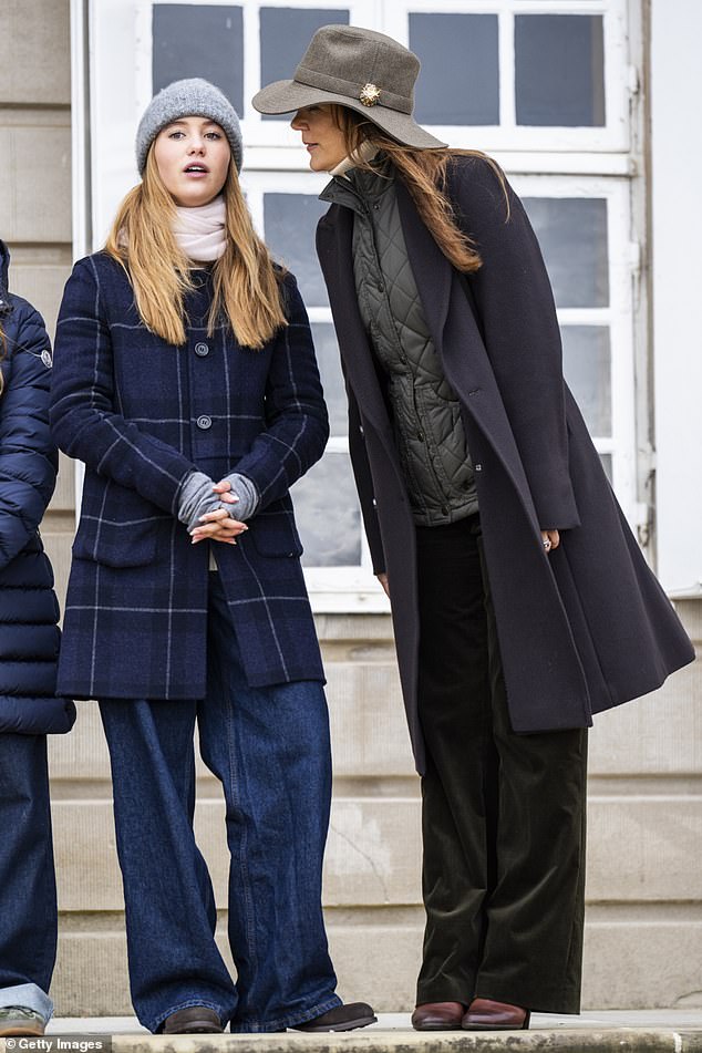 Mary was the epitome of equestrian style as she stepped out in a charcoal quilted vest which she paired with a long navy coat.