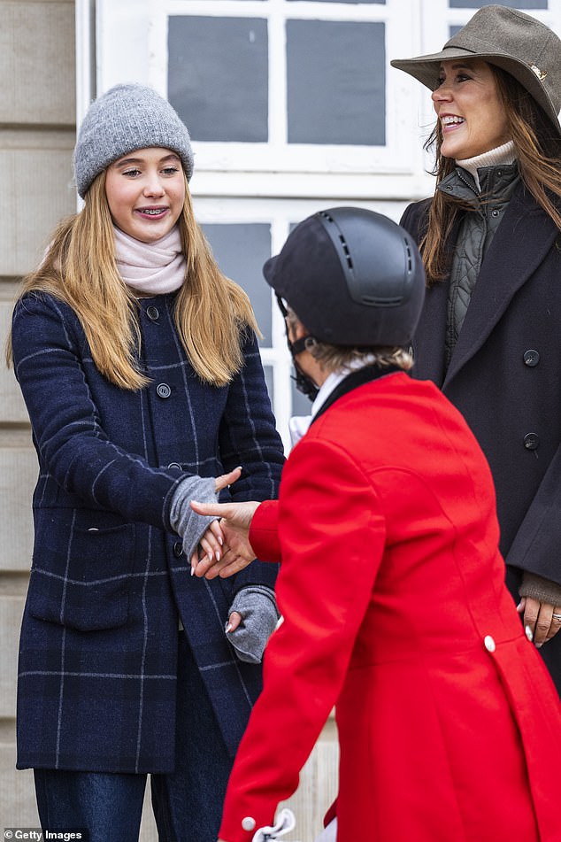 Princess Josephine is pictured shaking hands with one of the riders.