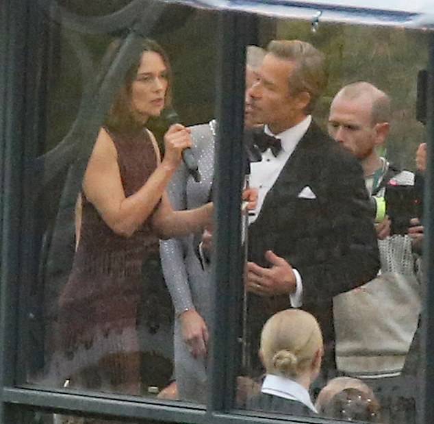 Co-star Guy Pearce, 57, was also on set and looked dapper in a classic tuxedo as he and Keira took to the stage during a tense scene.