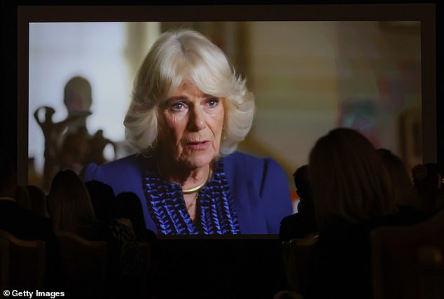 Queen Camilla on screen during a special reception for the exclusive screening of a new documentary