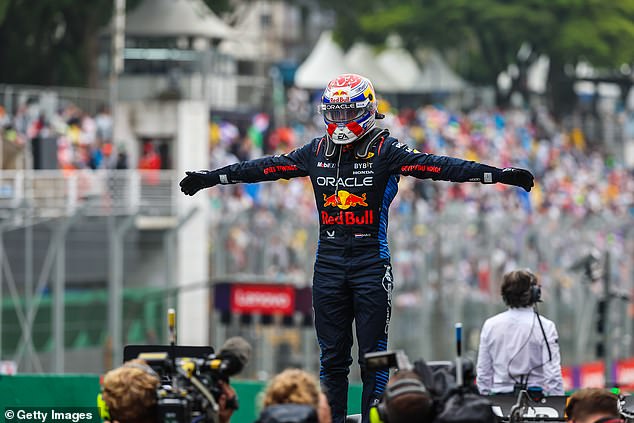 Verstappen photographed celebrating his impressive victory at the Autódromo José Carlos Pace