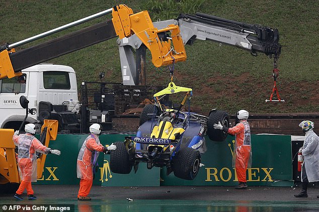 Colapinto's car was lifted and then removed from the side of the track by a large truck