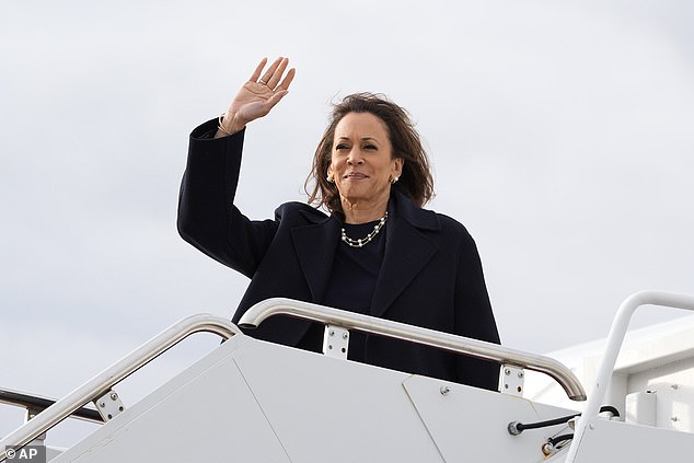 Democratic Vice Presidential candidate Kamala Harris waves as she boards Air Force Two at Oakland County International Airport in Waterford Township, Michigan, Sunday, Nov. 3, 2024, en route to Lansing, Michigan.