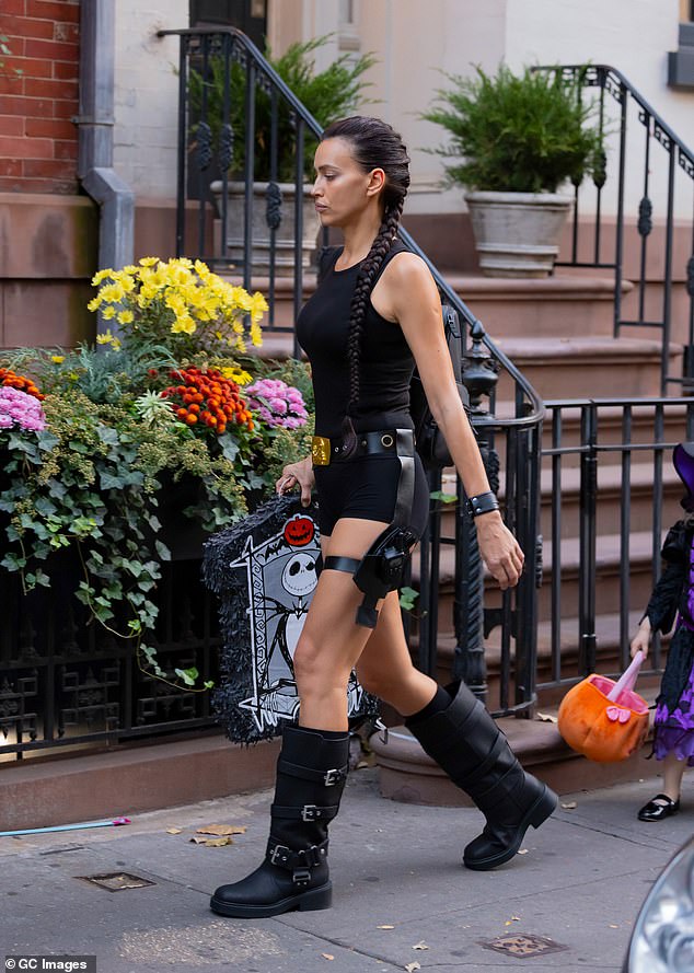 Irina was seen in New York City carrying a tomb-shaped piñata with Jack Skellington in it.