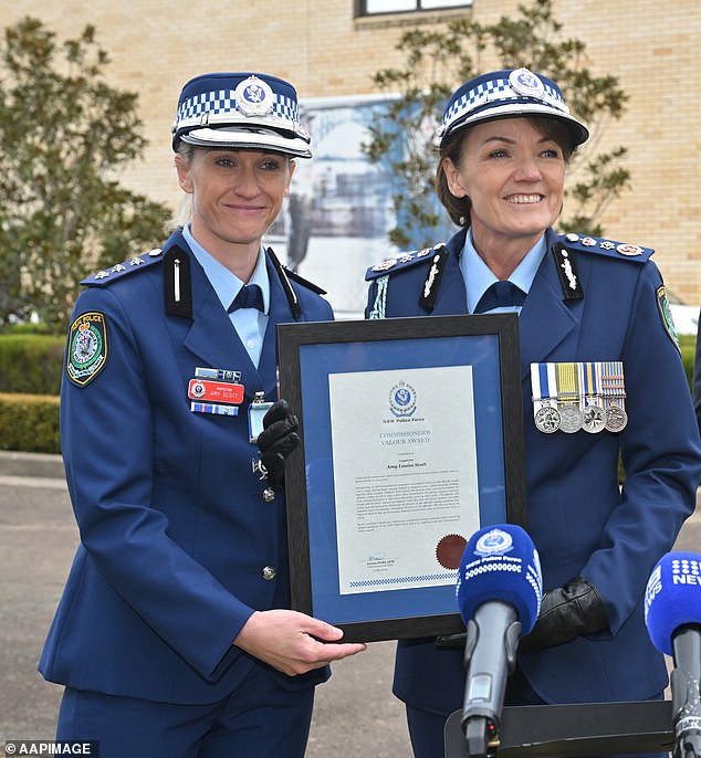 Inspector Scott received the Commissioner's Bravery Award following her bravery in the Bondi Junction stabbing attack (pictured Inspector Scott receives the award from Commissioner Karen Webb)