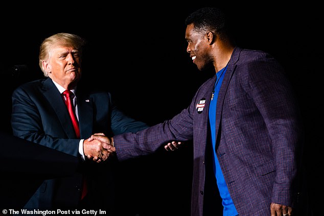 Trump and former NFL player Walker photographed together on the campaign trail in 2021