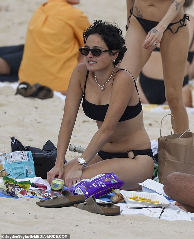 The Bodies Bodies Bodies star rocked a pair of sunglasses and a necklace as she enjoyed some snacks and hot chips.