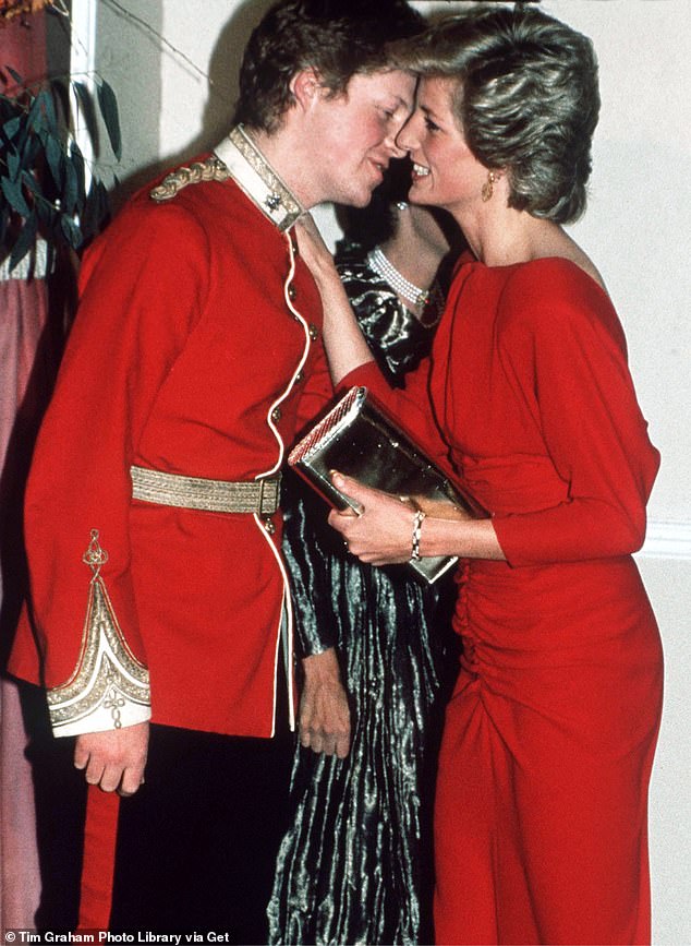 Princess Diana kisses her brother Viscount Althorp (later to become Earl Spencer) at the Birthright Red Ball in London in 1985.