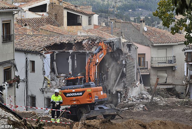 A view of the demolition work of a house damaged following flash floods in Letur, Albacete province, Spain