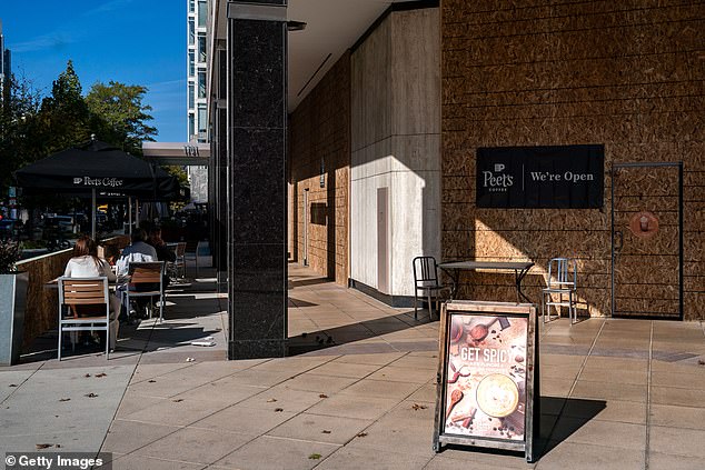 Cafes remain open despite boarded-up windows