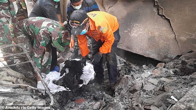 Search and rescue teams carry out an operation after a volcanic eruption occurred on Mount Lewotobi Laki Laki in the Flores Islands, Indonesia, on November 4, 2024.