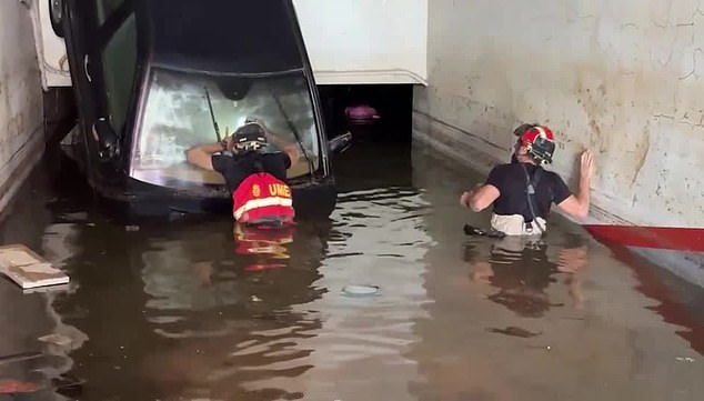 Rescuers continue to search for survivors fearing underwater car parks could become 