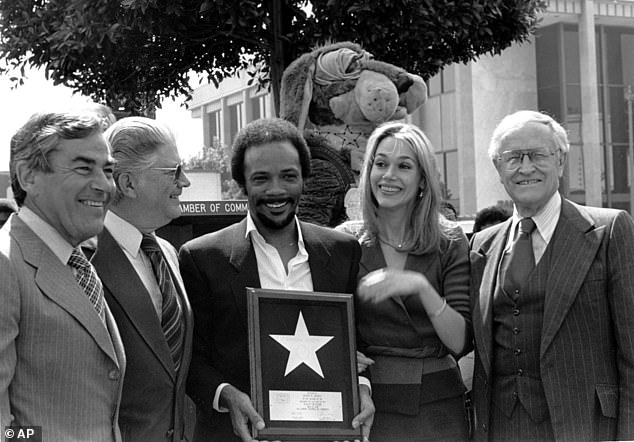 Quincy Jones and his wife Peggy Lipton hold Jones' star that was placed on the Hollywood Walk of Fame in Los Angeles in March 1980.