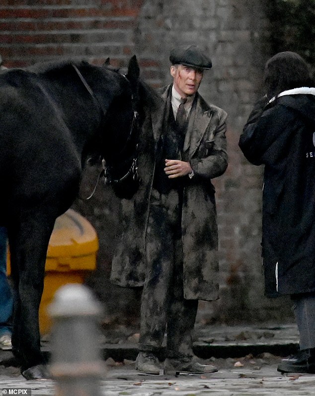 Cillian chatted to a member of the crew during filming.