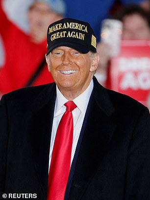 Former President Donald Trump smiles as the crowd applauds during his rally in Kinston, North Carolina, on Sunday, Nov. 3.