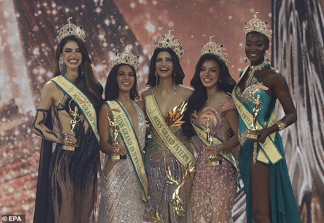 Moments before Miss Grand Myanmar director Htoo Ant Lwin took the crown from Thae Su Nyein (pictured, second from right) and snatched her sash in protest.