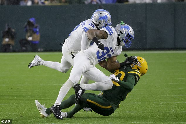 Brian Branch (32) is penalized for unnecessary roughness after a tackle on Bo Melton