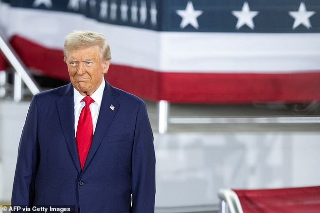 Trump arrives to speak during a campaign rally at the JS Dorton Arena in Raleigh, North Carolina, on November 4.