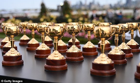 MELBOURNE, AUSTRALIA - NOVEMBER 2: Miniature Melbourne Cups are seen at the Melbourne Cup Barrier Draw during the 2024 Penfolds Victoria Derby Day at Flemington Racecourse on November 2, 2024 in Melbourne, Australia. (Photo by Vince Caligiuri/Getty Images)