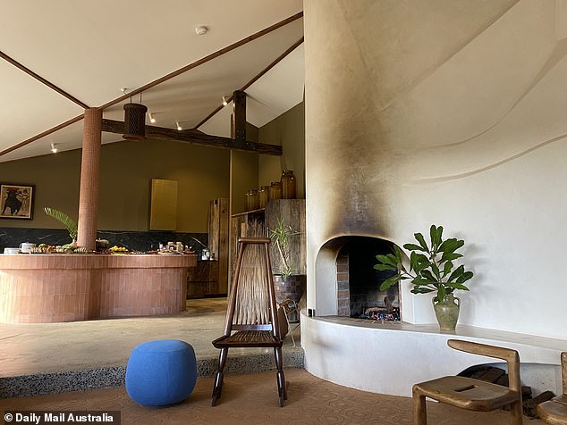 Pictured: The ranch's living room and kitchen, decorated in rustic decor.