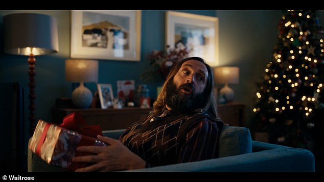 Pictured: Joe Wilkinson as Uncle Phil. Meanwhile, Samira, played by Thakrar, shakes the Christmas cocktails and the children, played by Naya and Sonny, cover the gingerbread house.