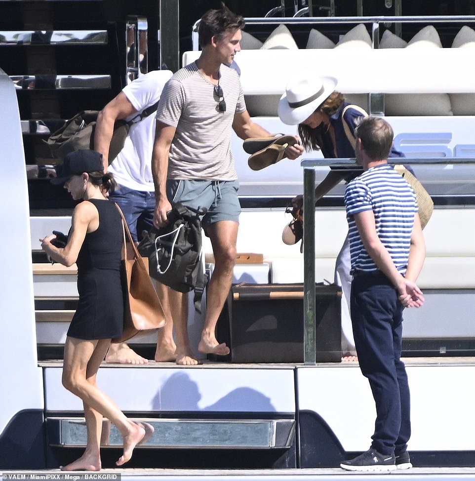 The friends all picked up their flip flops as they prepared to leave the yacht.