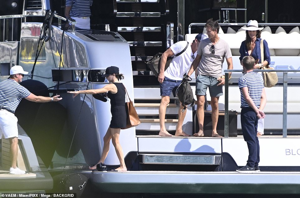 Victoria was seen being helped off the yacht's swim platform so she could board a tender.