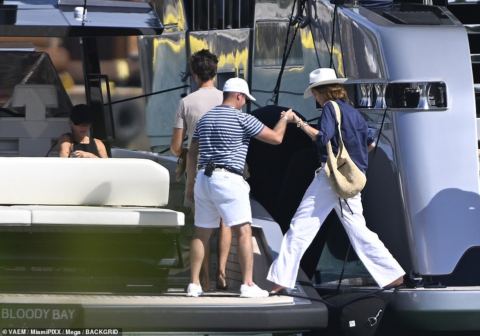 In another snapshot, Cindy was also seen being helped off the yacht and onto the tender.