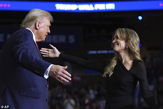 Trump and Kelly hug after he endorsed the former president the night before Election Day.