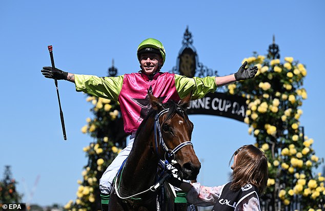 Robbie Dolan celebrates victory after riding Knight's Choice to glory in the 2024 Melbourne Cup at Flemington Racecourse.