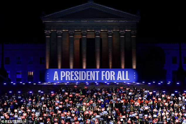 Supporters of Vice President Kamala Harris stand on the iconic 'Rocky Steps' in front of the Philadelphia Museum of Art to commemorate the Democratic candidate's final campaign rally before Election Day.