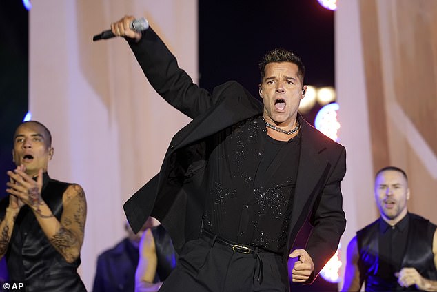 Ricky Martin shakes his hips during a performance Monday night in Philadelphia as part of Vice President Kamala Harris' last rally before Election Day. Martin is one of the few prominent Puerto Ricans who became more active with the Harris campaign after the Madison Square Garden rally.