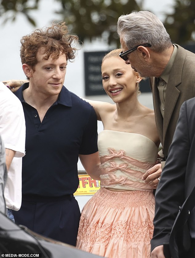 Her brown hair was up in a bun and a light coat of nude makeup helped highlight her natural beauty.