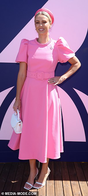 TV presenter Sylvia Jeffreys, 38, looked glamorous in a stunning pink midi dress which featured puff sleeves and buckled belt details around the bodice.