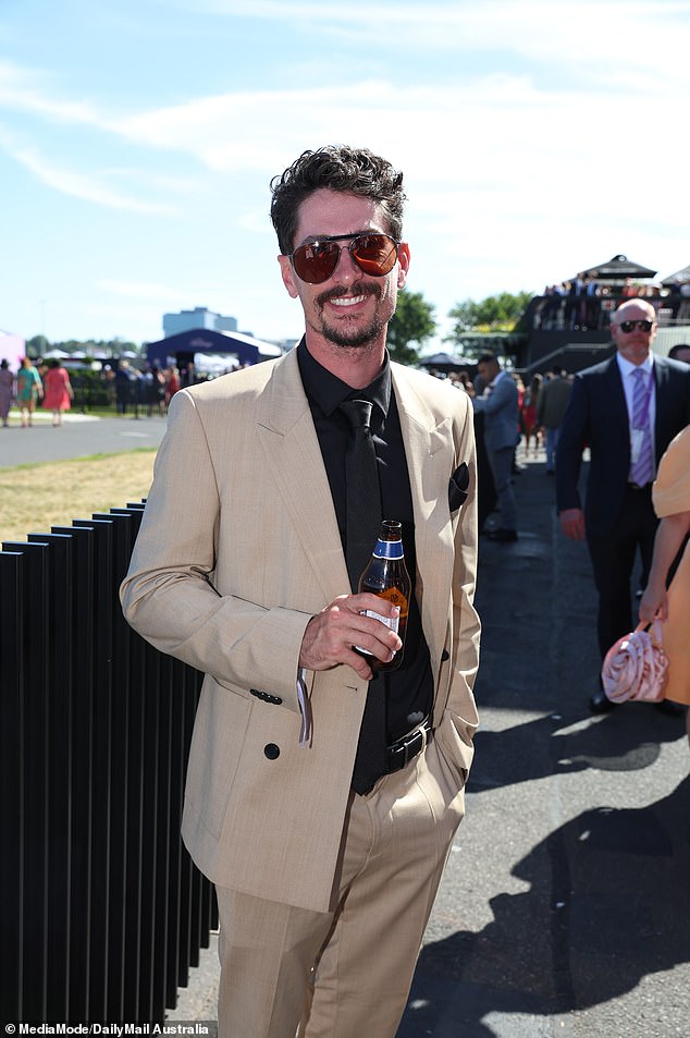 Meanwhile, Brad kept his look classic yet stylish in a beige suit jacket, black shirt, and matching pants, complete with aviator sunglasses.