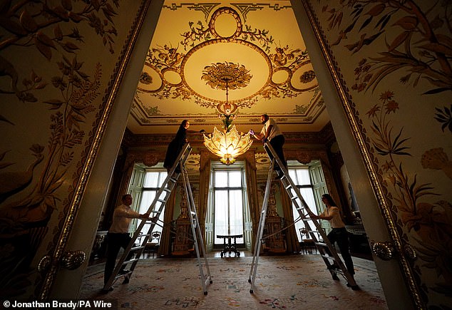 Preparations take place in the Central Room in the east wing of Buckingham Palace in June.