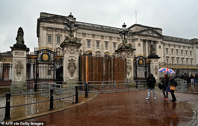 The gates of Buckingham Palace were boarded up in March after a car crashed into them.