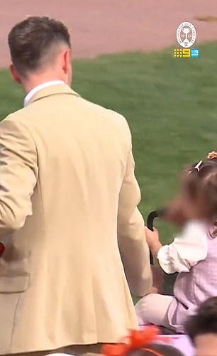 Dolan was seen carrying his daughter in a pink suitcase around the grounds of Flemington.