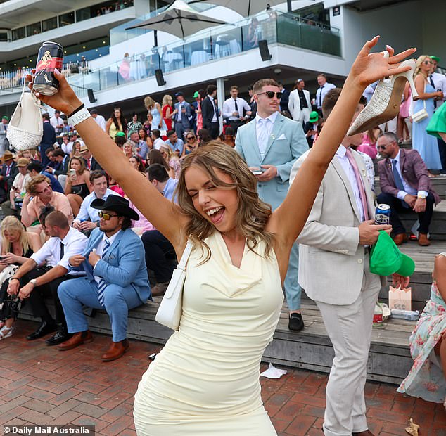 Young attendees dressed in minidresses kept the atmosphere high as race day progressed in Melbourne.