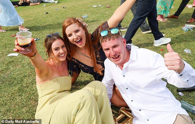 A group of friends held on to their drinks with big smiles on their faces as they posed for photographs.