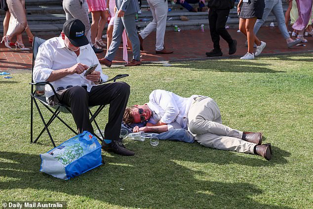 One attendee took a quick nap in the sun while surrounded by empty plastic cups.