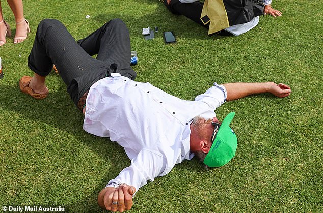 The Melbourne Cup appeared to be a heavy afternoon for a man who collapsed on the ground.