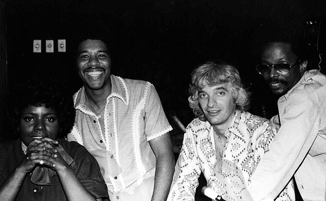 Gaynor, her ex-husband Linwood Simon, Diamond and Harold Wheeler photographed together around 1983, the year the two parties signed a recording agreement, according to the lawsuit.