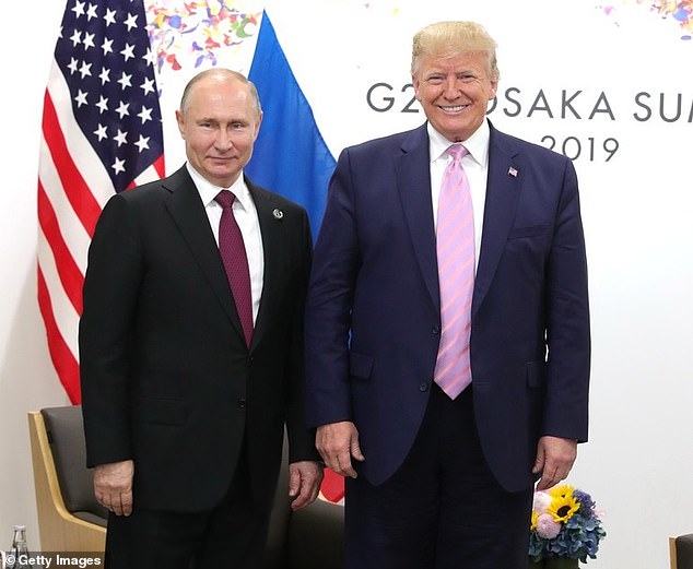 FILE IMAGE: U.S. President Donald Trump (R) meets with Russian President Vladimir Putin (L) on the first day of the G20 summit in Osaka, Japan, June 28, 2019.