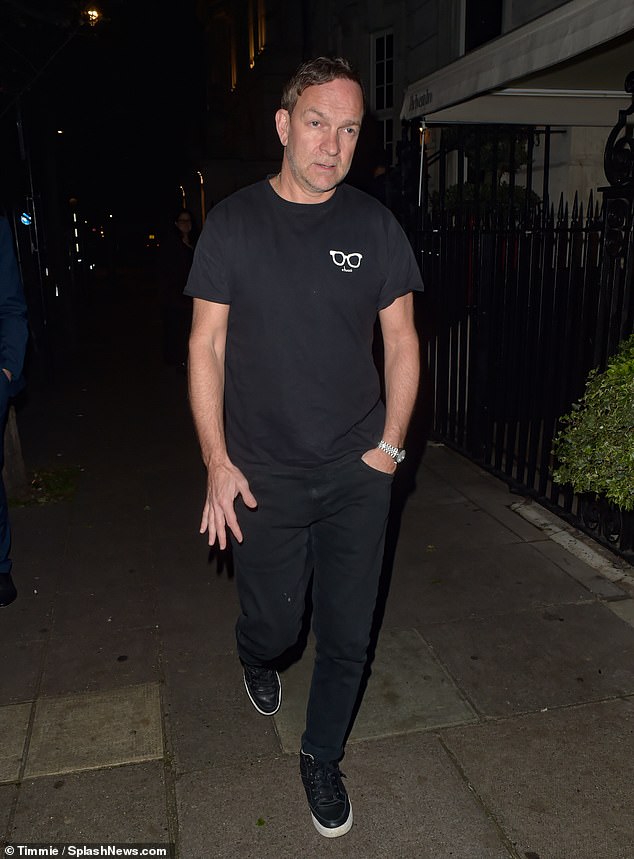 Holly's producer husband Dan opted for a casual look, wearing a graphic print t-shirt, dark pants and a pair of sneakers.