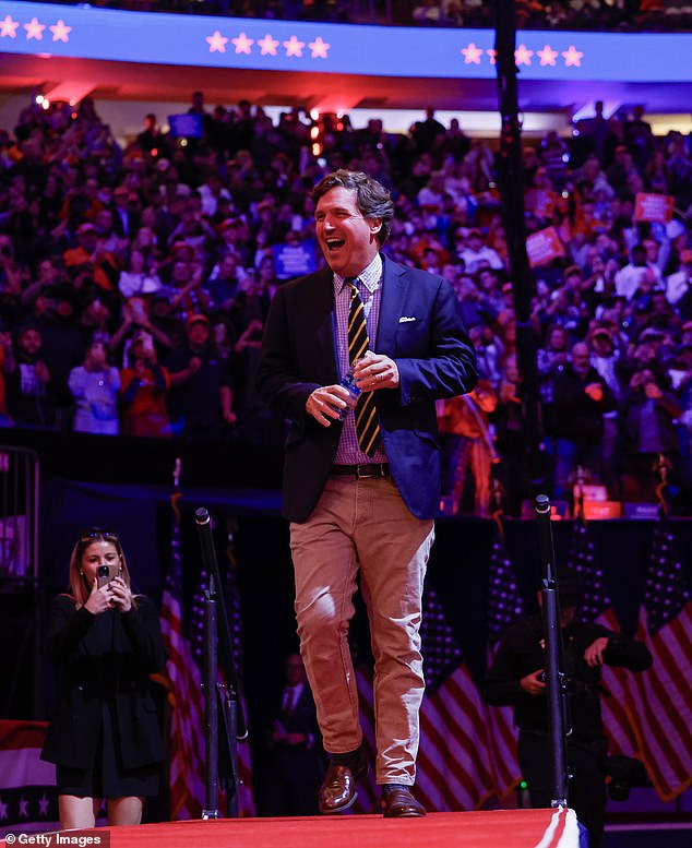 Carlson, photographed at Trump's Madison Square Garden rally on October 27, took his wild comments even further by dismissing scientific evidence that climate change is attributed to hurricanes and instead claiming that natural disasters are 