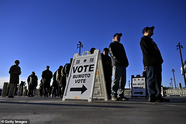 Voters line up to cast their ballots at Allegiant Stadium on November 5, 2024 in Las Vegas, Nevada. Americans cast their votes today in the presidential race between Republican former President Donald Trump and Democratic Vice President Kamala Harris, as well as in multiple state elections.