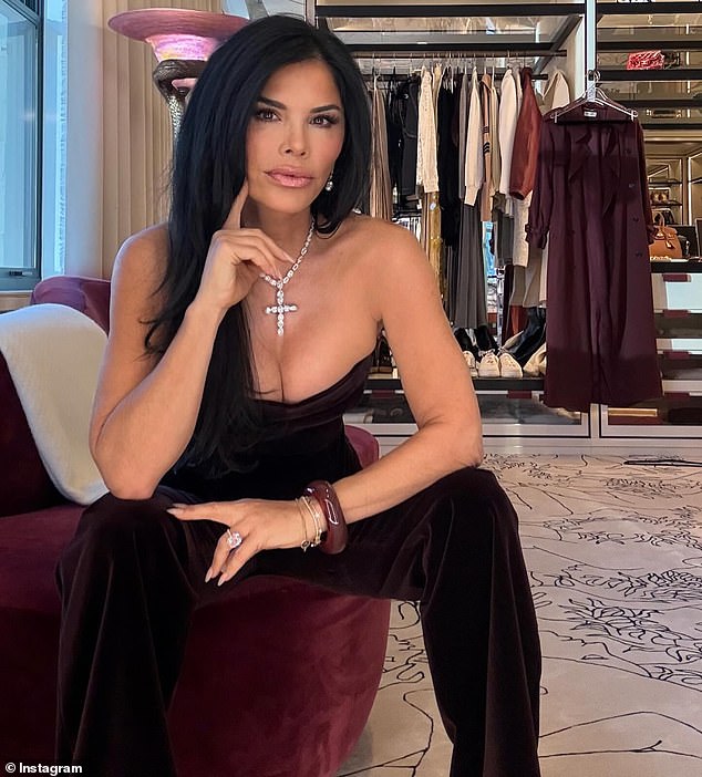 Here Lauren shows off her Bezos diamond ring while posing in a closet.