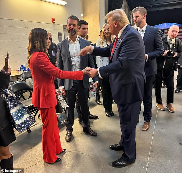 Danica Patrick wore a red pantsuit as she met with the former president, two of his sons, Eric and Donald Trump Jr., and daughter Tiffany Trump backstage at his rally.