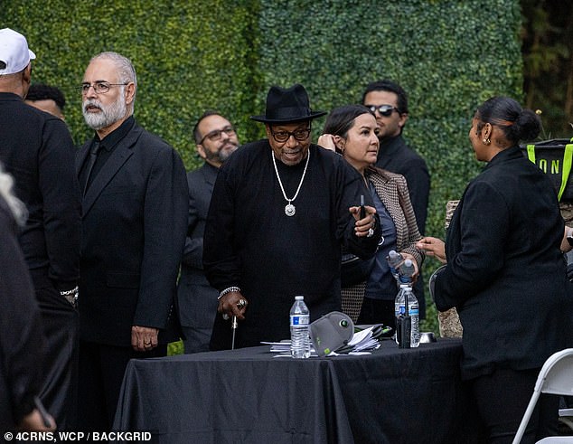 Upon arriving at the home, attendees apparently checked in at a security table before being guided to an area in the backyard.